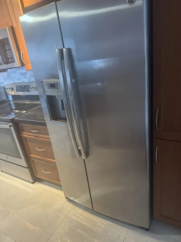 GE side-by-side refrigerator in the kitchen