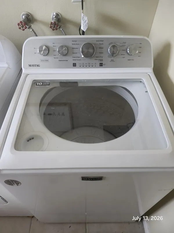 Maytag top-load washer in the laundry room