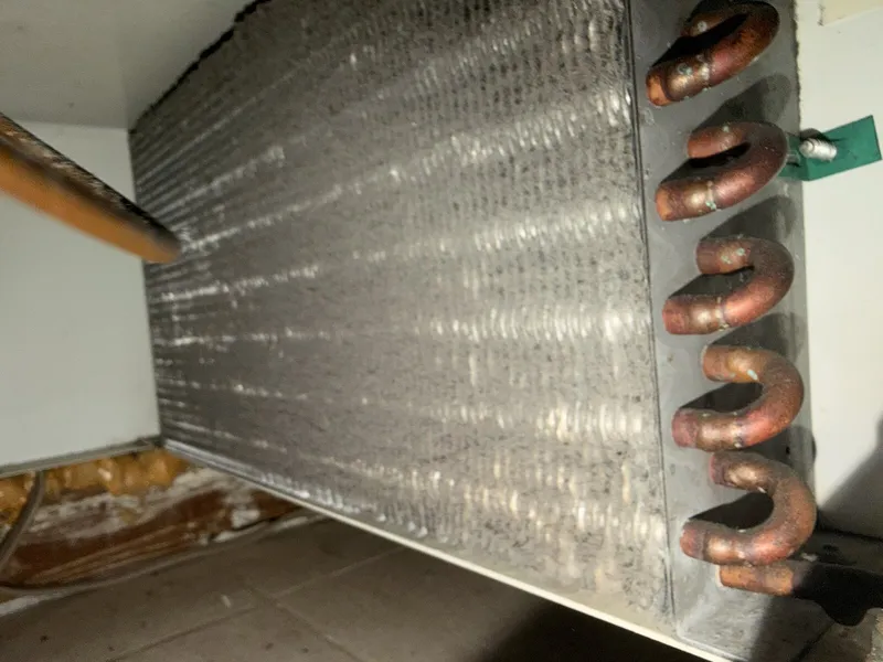 Dusty Sub-Zero condenser coils before cleaning
